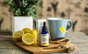 CBD dropper with cup and lemons